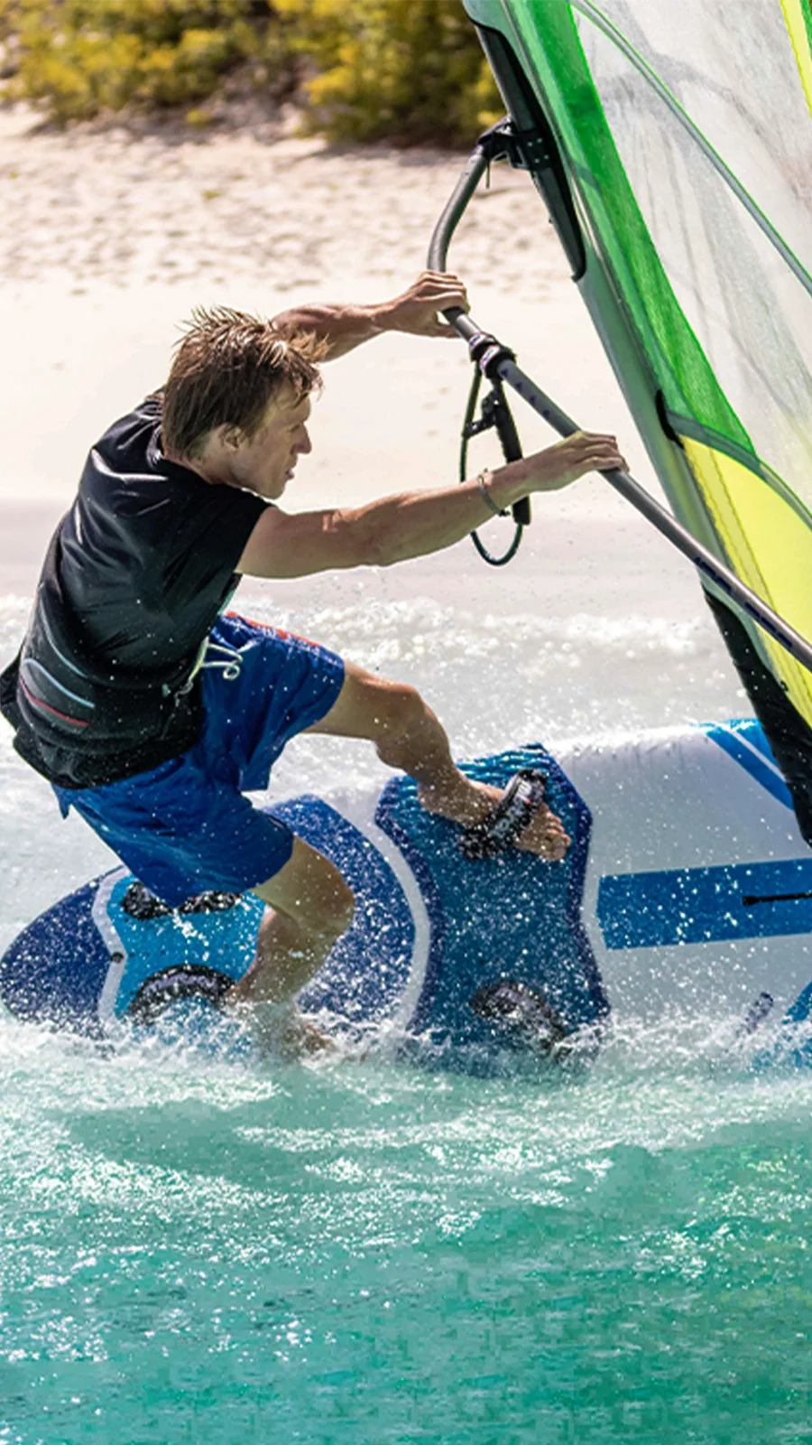 A man on a wind surfboard