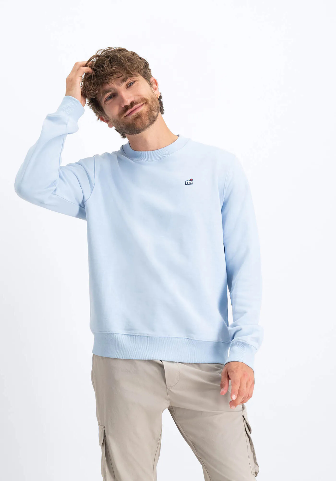 A man wearing a Mistral sweater